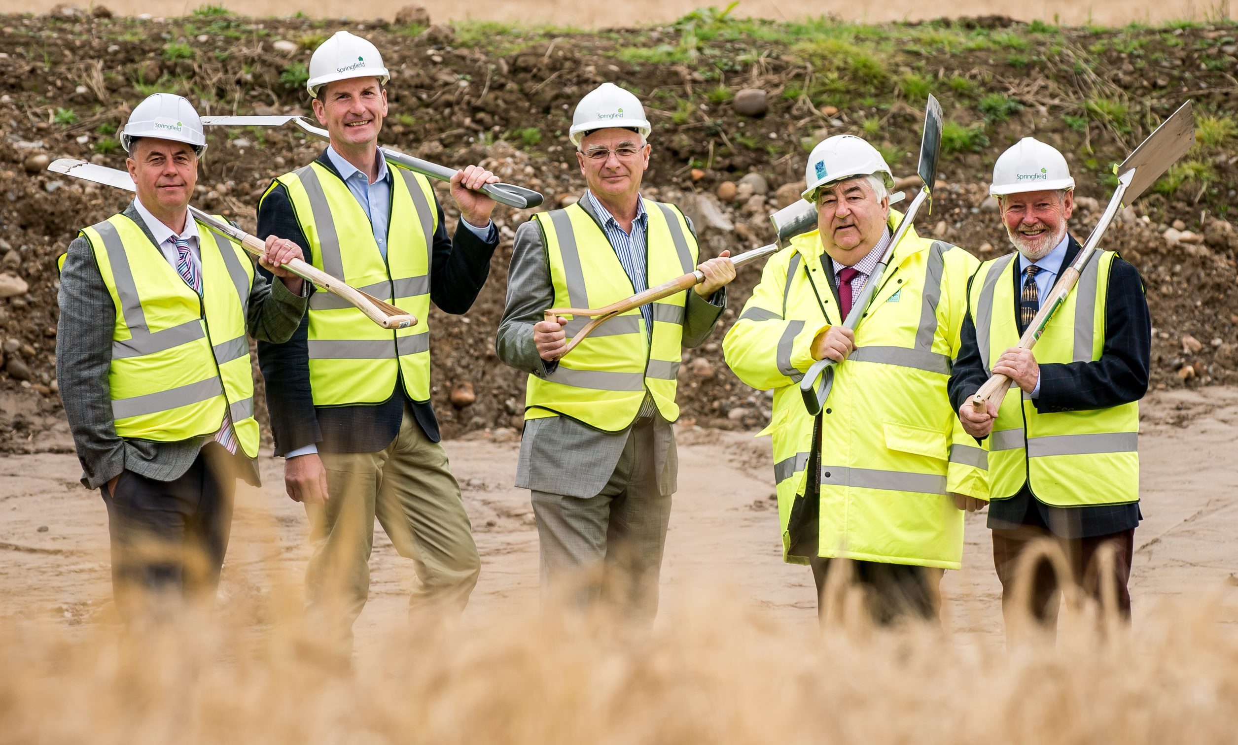 Pictured at the Bertha Park, groundbreaking event are, from left, councillors John Rebbeck and Dave Doogan,  Sandy Adam from Springfield Properties, leader of Perth and Kinross Council Ian Campbell and land owner, Alistair Ritchie,