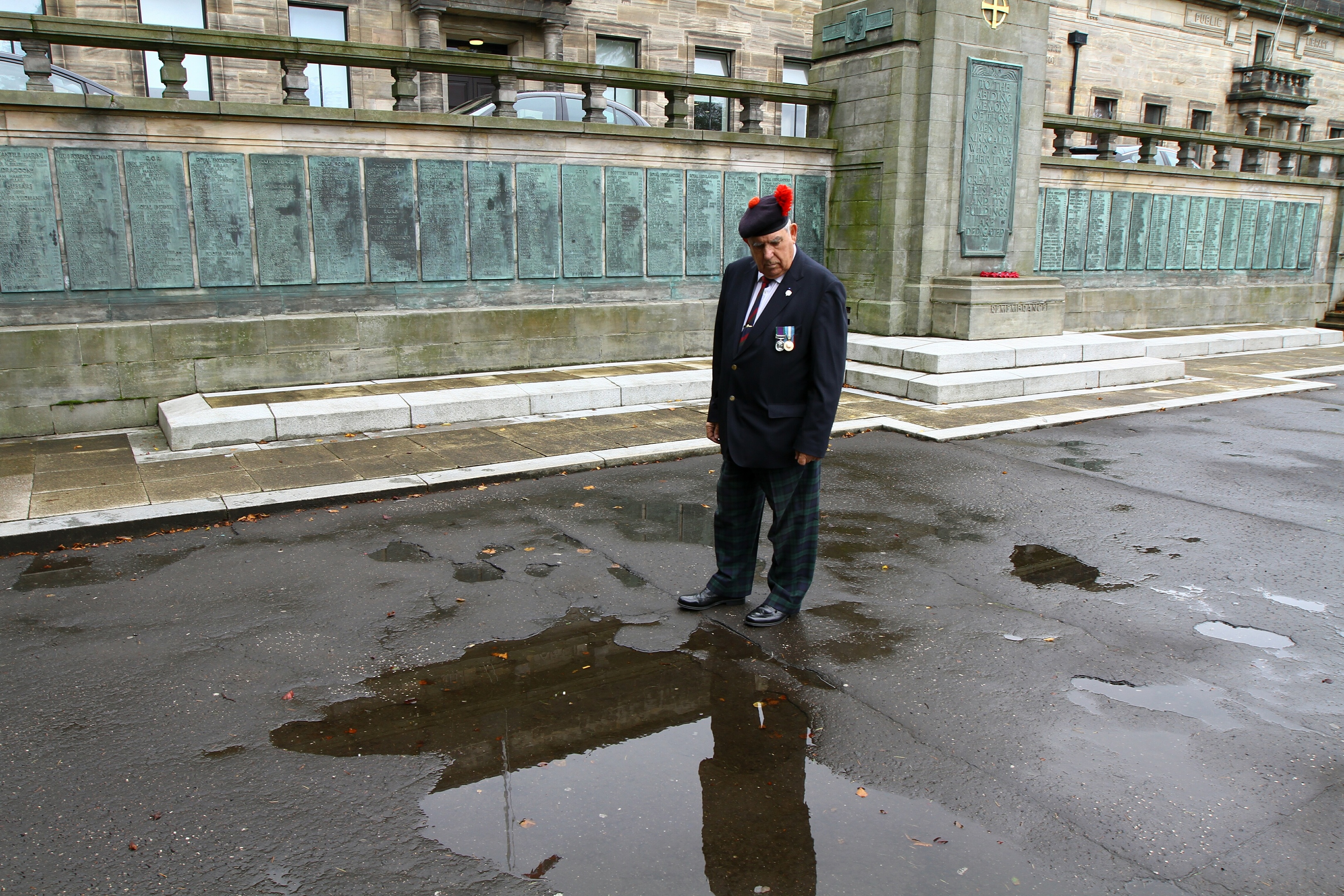 Rob Scott inspects one of the pot holes