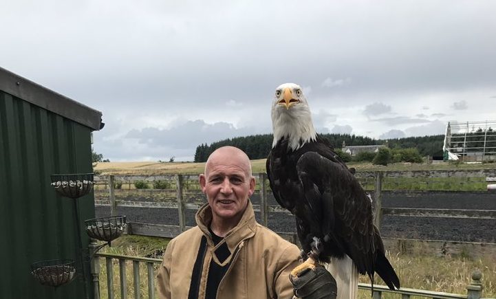 Fire fighter Fraser Doig with Pilgrim after his successful rescue