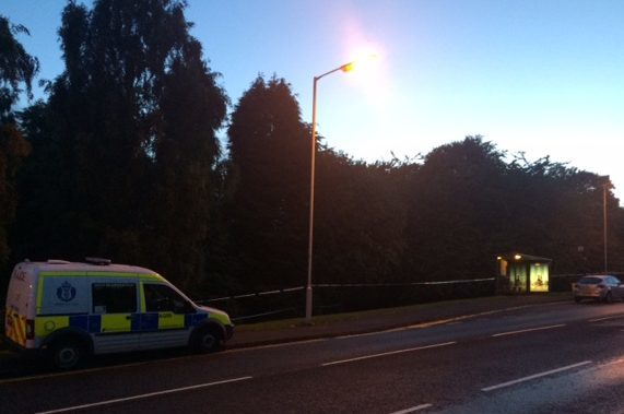 A police van at the scene of the incident in Moodie Street last night.