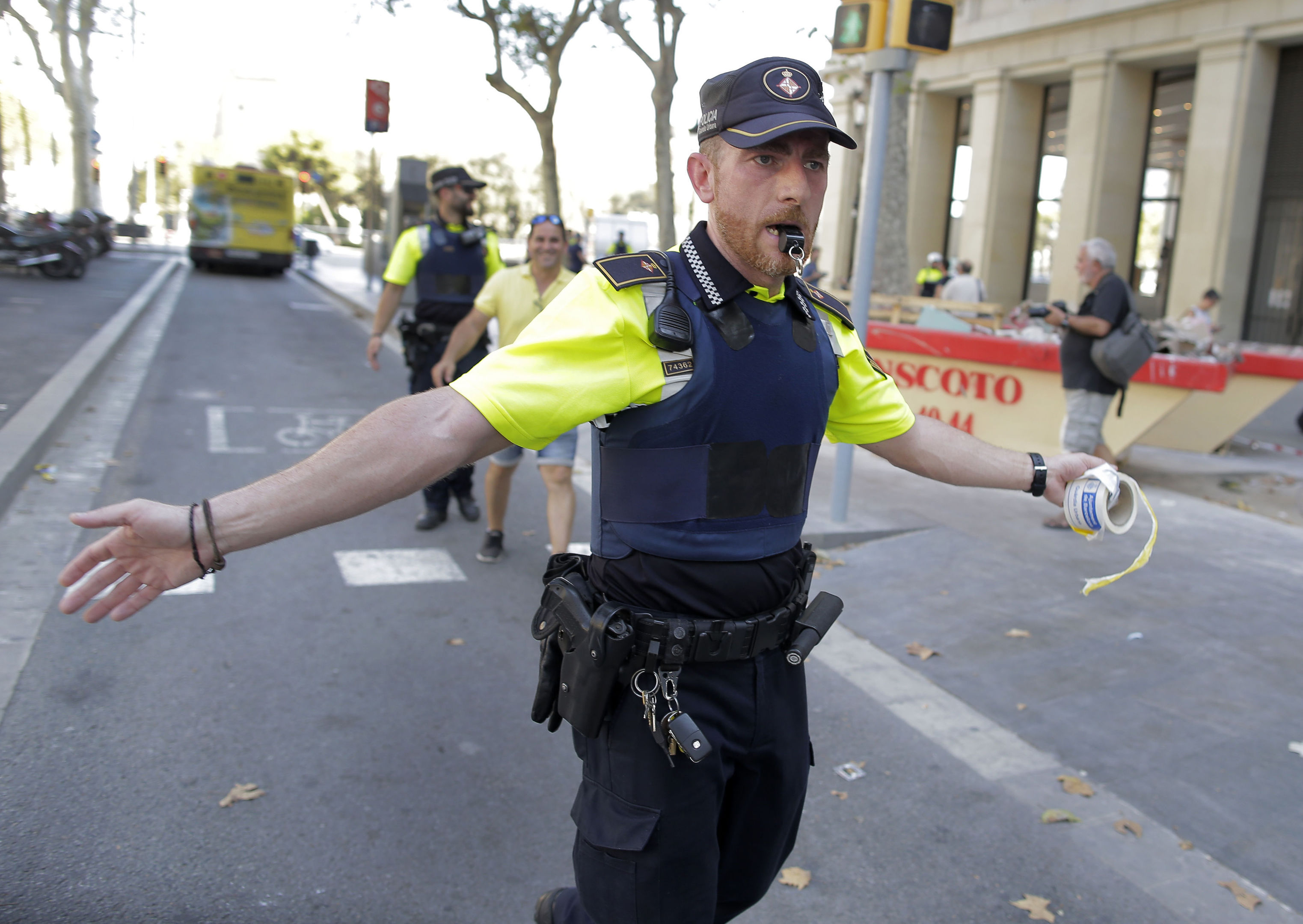 A police officer cordon off a street in Barcelona, Spain
