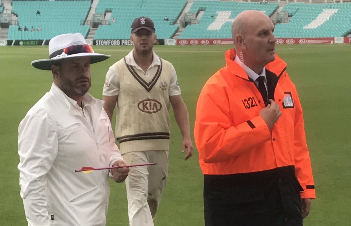 Picture taken with permission from the twitter feed of @topmanjem of a match official holding an arrow that was fired on to the pitch at the Kia Oval during a County Championship clash between Surrey and Middlesex.