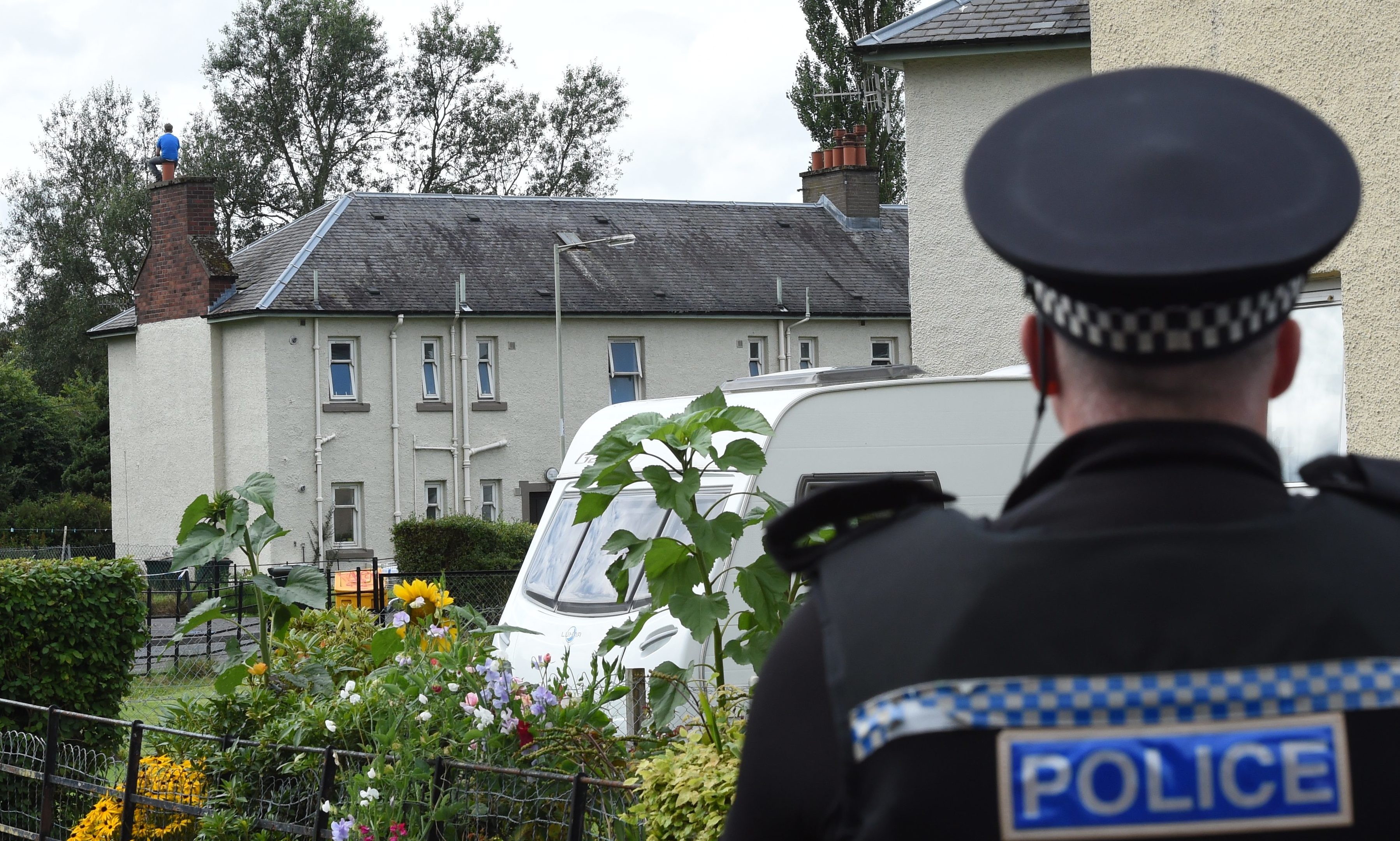 Scores of police were drafted in for Sunday's rooftop stand-off.