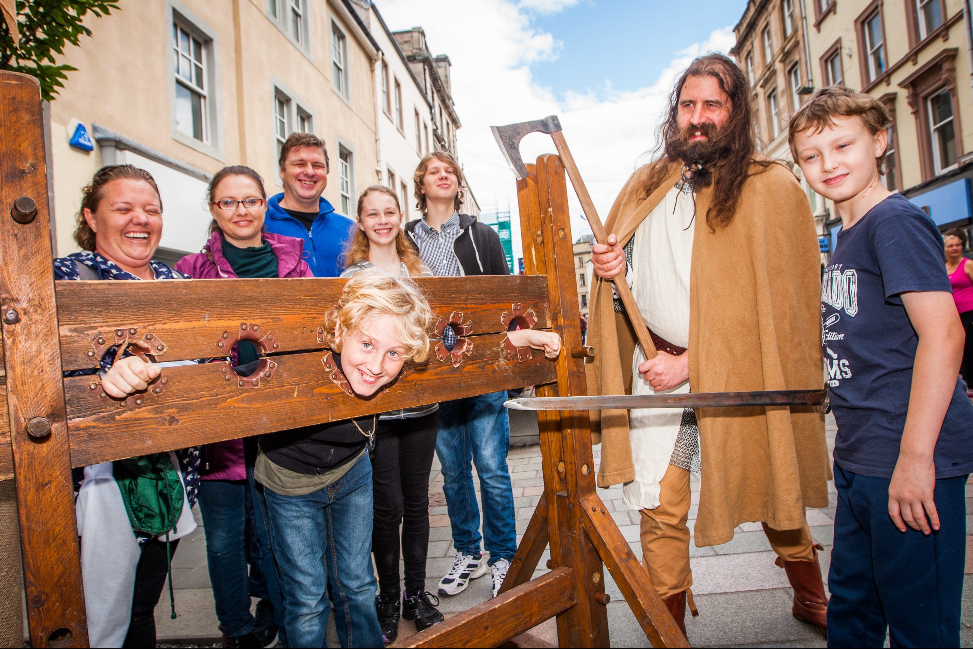 Picture shows at the front, (left to right), Daniel Du Toit (in stocks, aged, 11,  from Perth) alongside Andrew Finlay (Knights of Monymusk) and Daniel's cousin Tristan Diesel, 11, from Perth, with family behind.