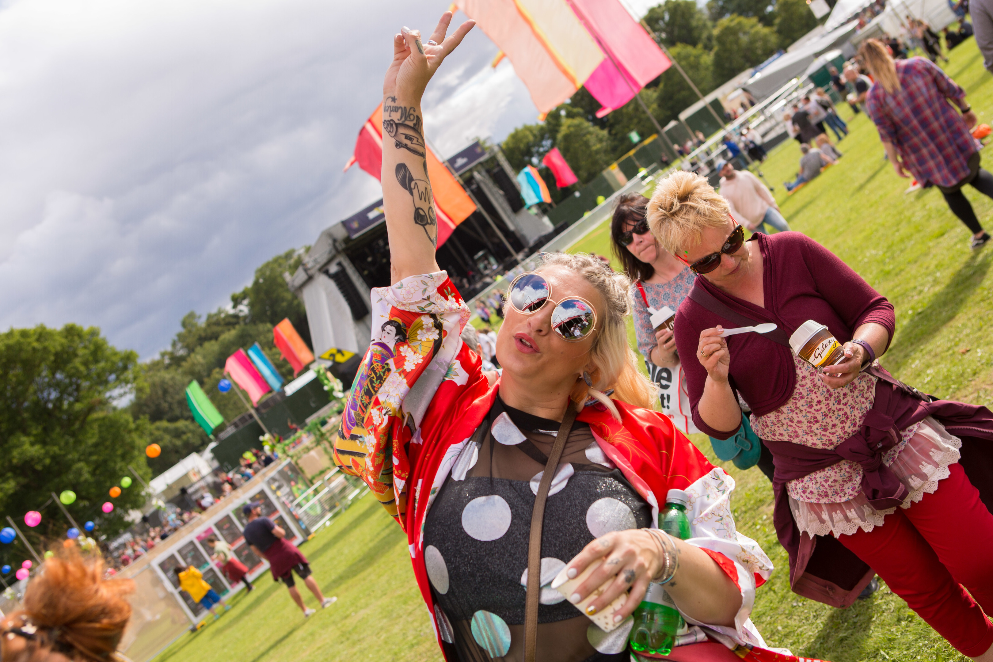 People enjoying the music in the sunshine at Carnival 56