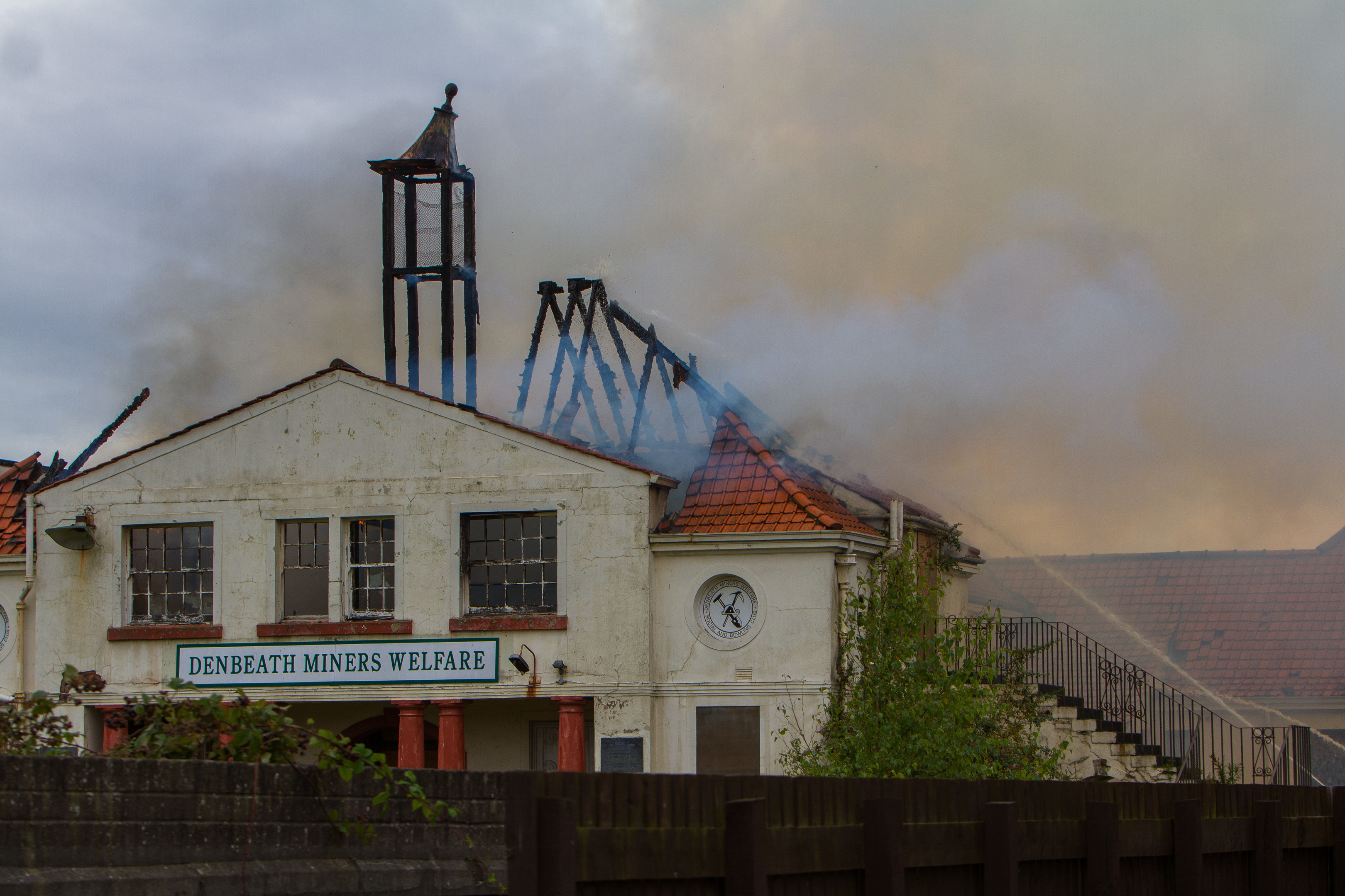 The fire destroyed the building's roof.