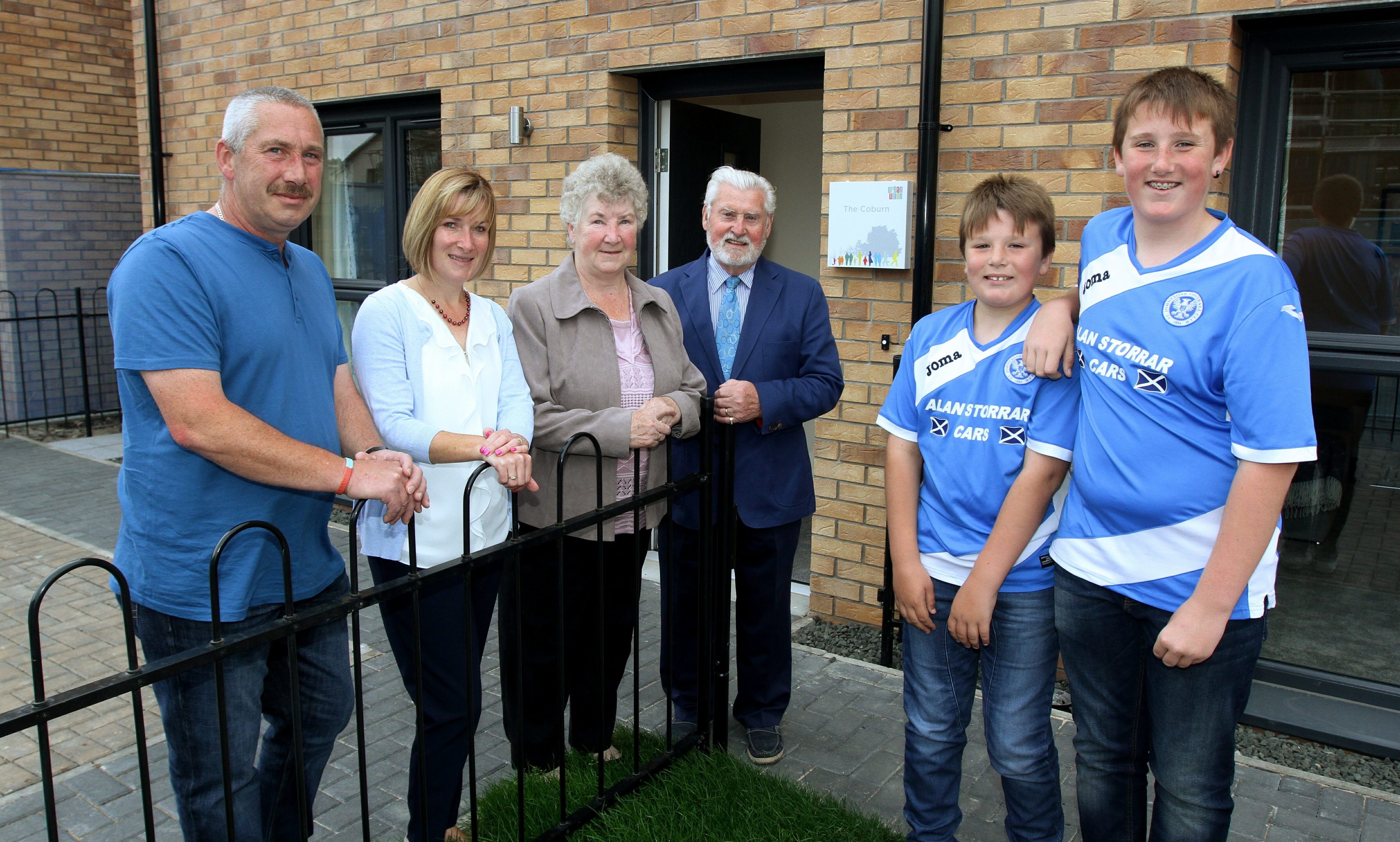 Son Ian (51) with his sons and Willies  grandsons Euan (11) & Cameron(13) Coburn,willies daughter Lorraine (49),wife Jean (74), brother Jackie (79) at the new Coburn house.