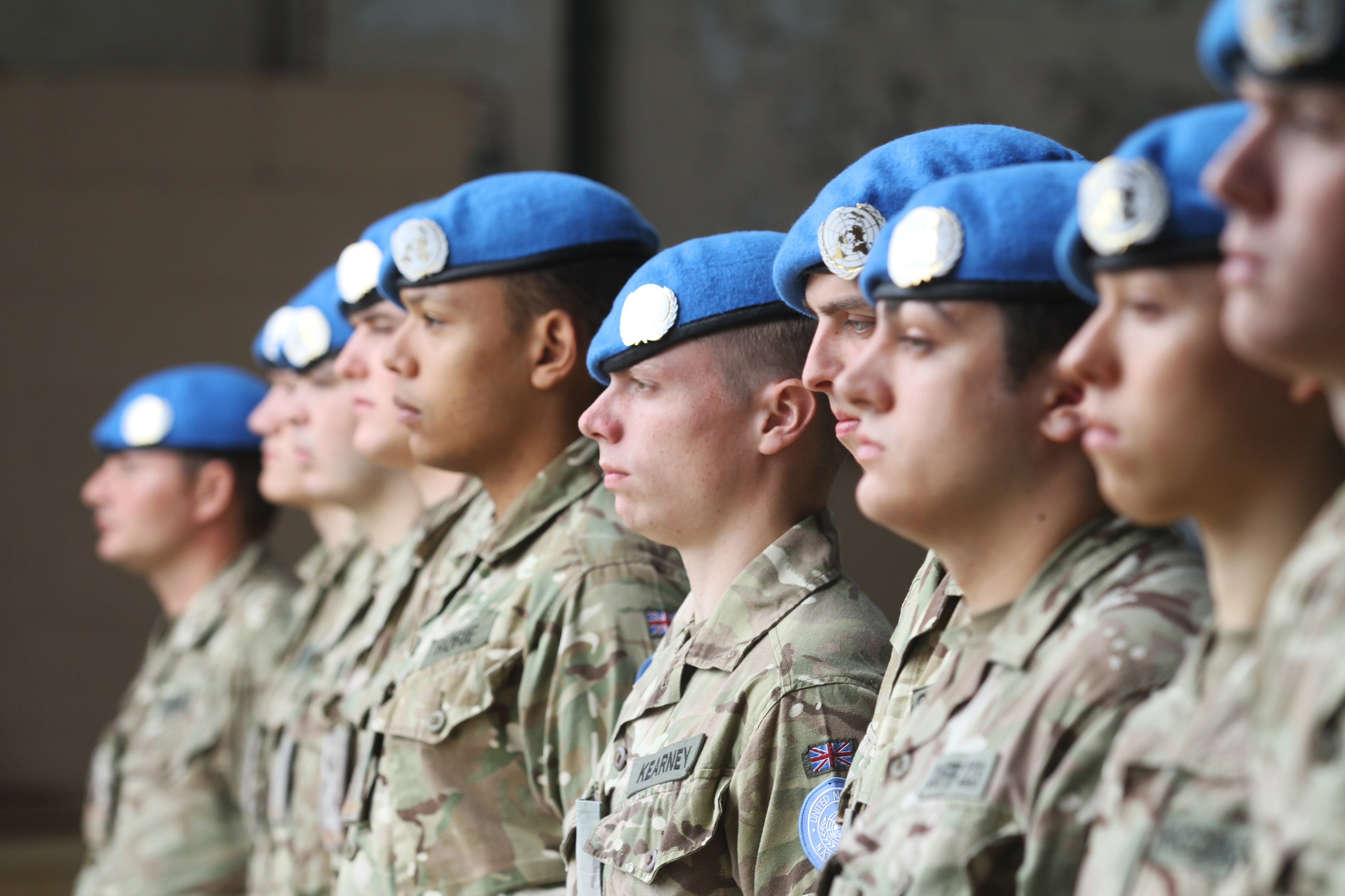 The soldiers with their UN blue berets and badges.