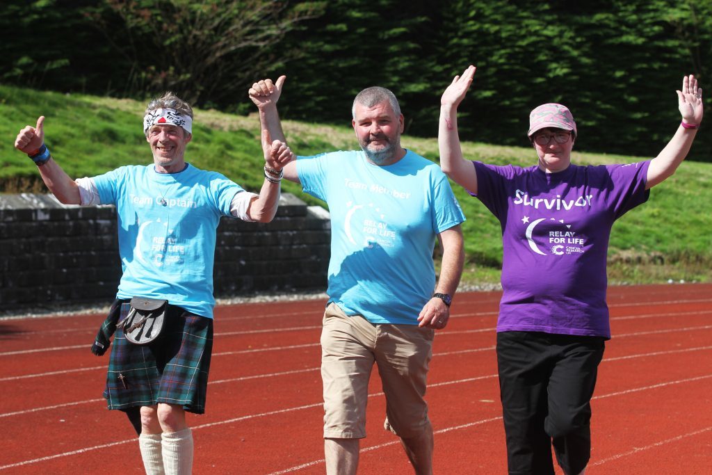 Billy Jeffrey from team Running Scotsman with Denis and Susan Jayne Christie.