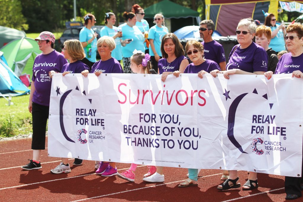 Survivors of cancer lead the way for the first lap.