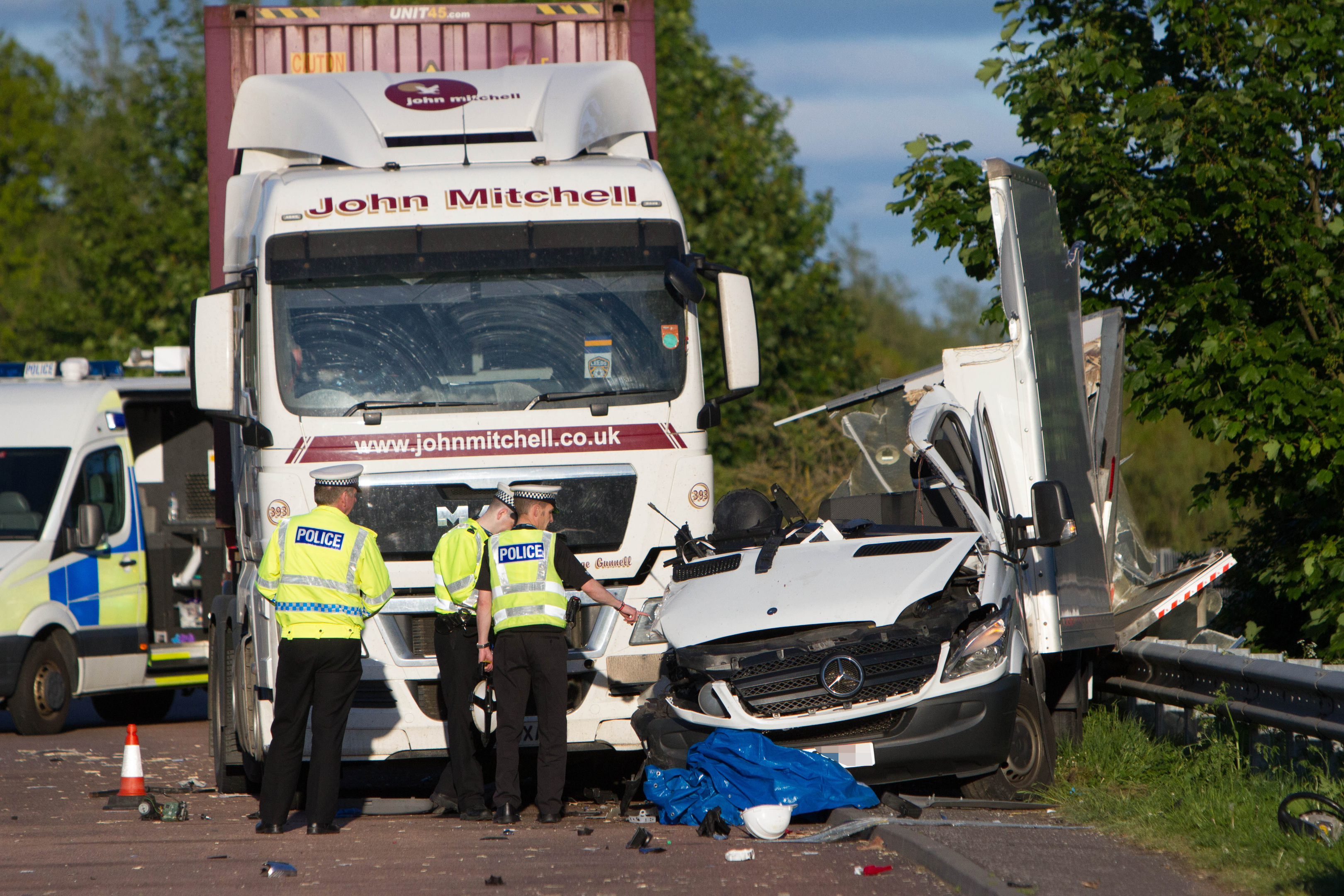 The Mercedes Sprinter van came to rest between the lorry cab and the crash barrier.