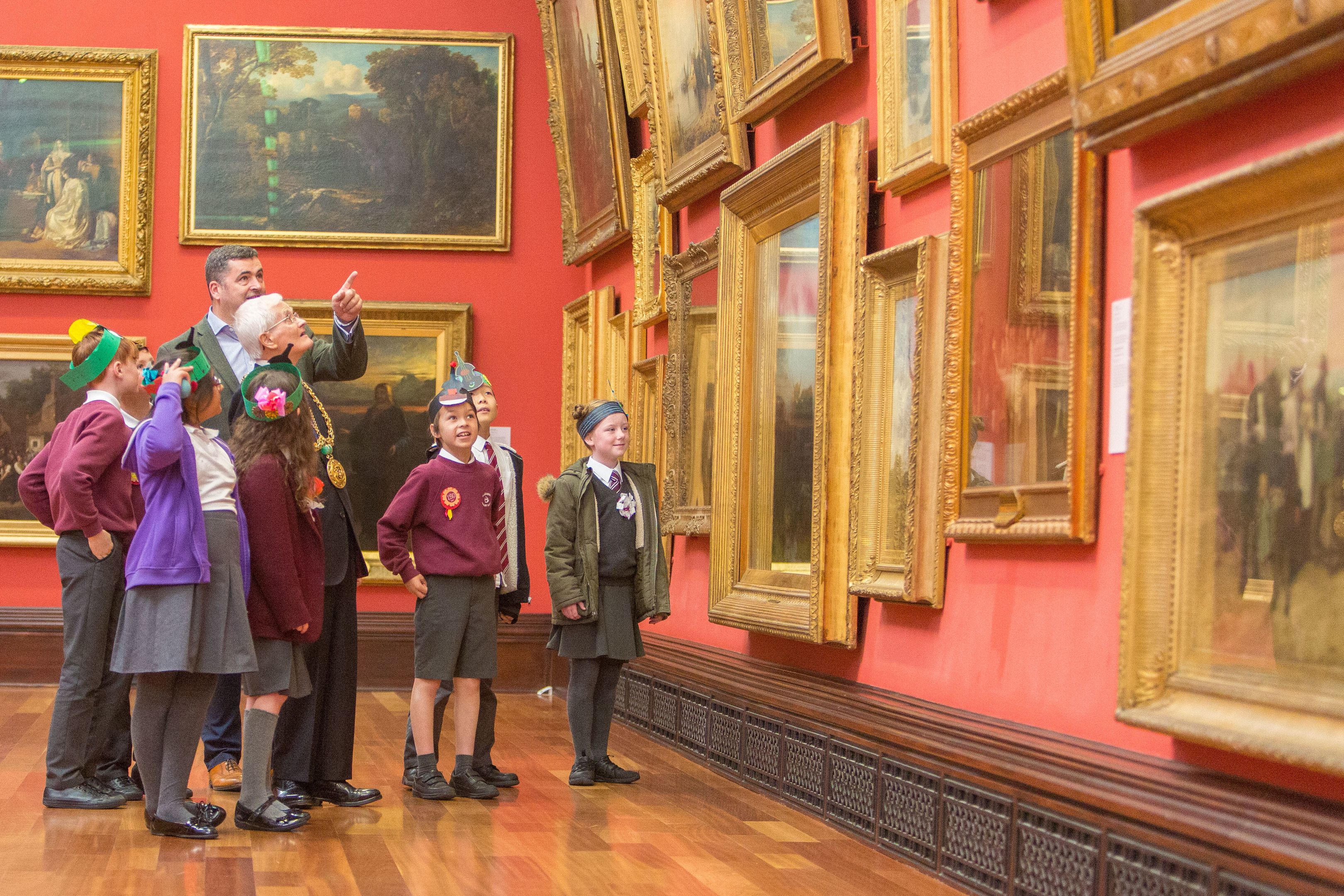 The Lord Provost Ian Borthwick enjoys a tour of the McManus with Billy Gartley, head of cultural services, and children from Blackness Primary.