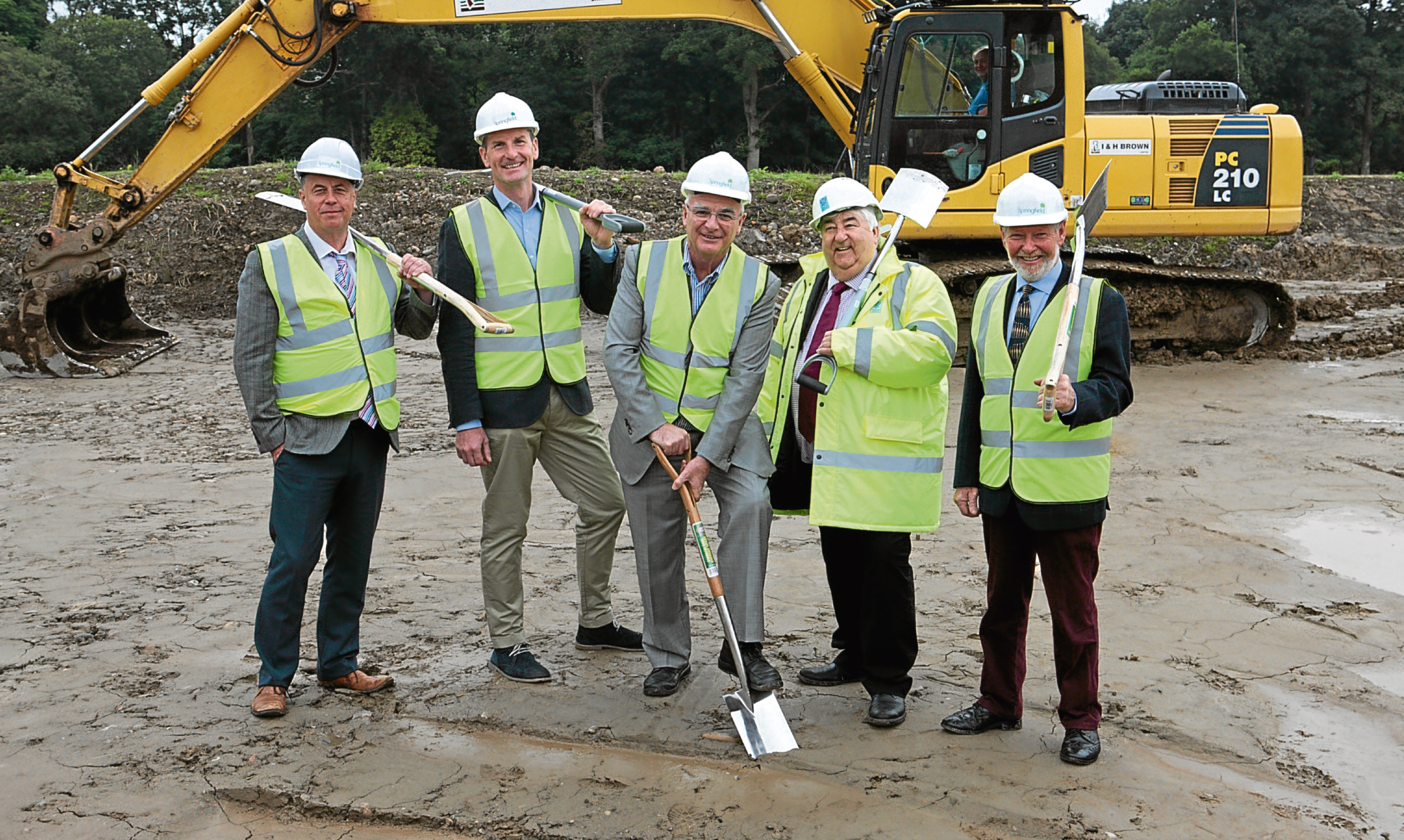 Springfield chairman Sandy Adam (centre) at the ground cutting ceremony for Bertha Park last month.