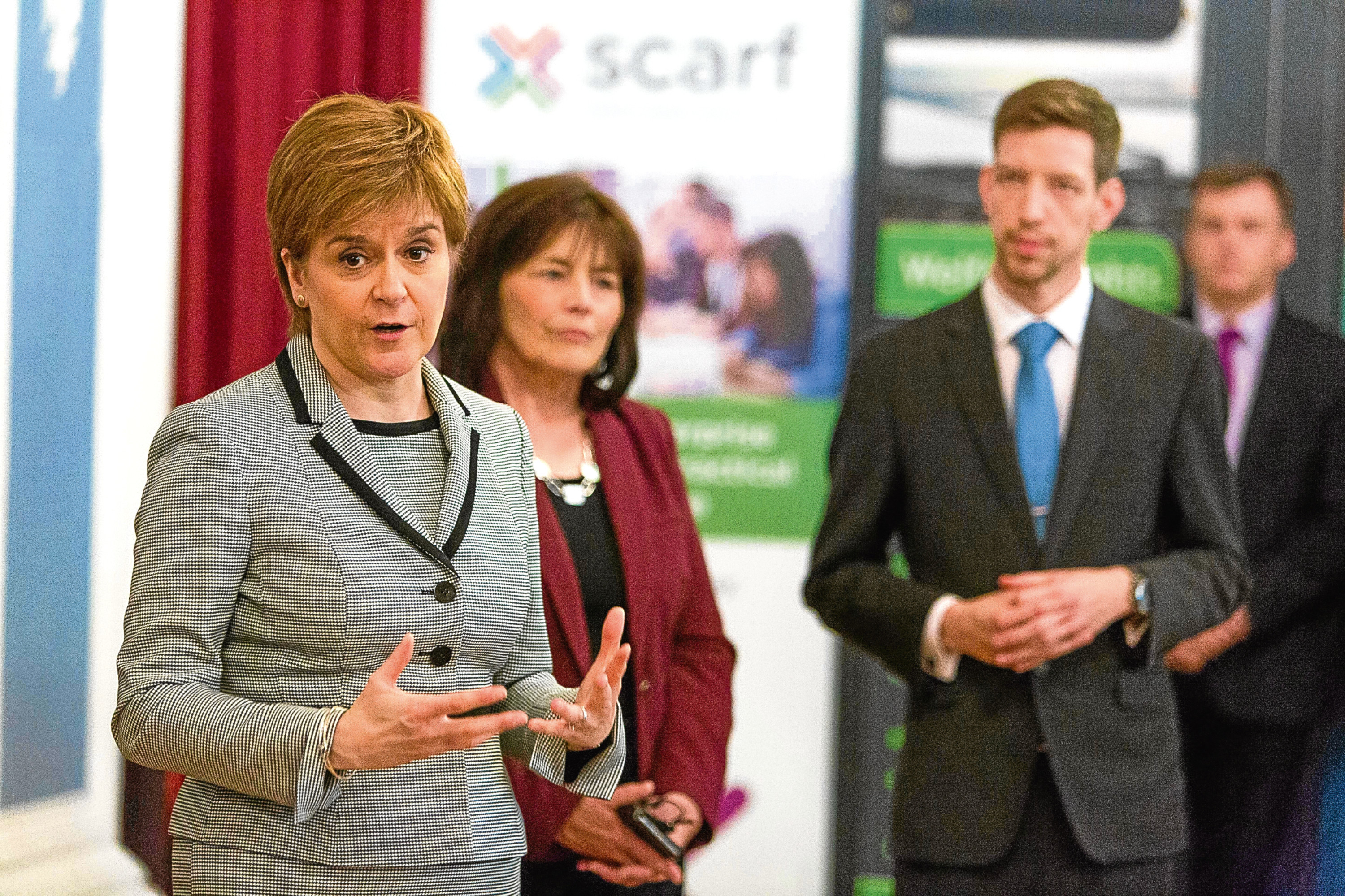 Nicola Sturgeon in Dundee with social security minister Jeane Freeman and council leader John Alexander