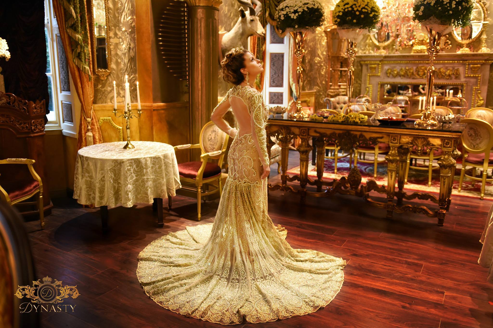 Dynasty's promotional photo shows a model admiring the opulent interior of the restaurant.