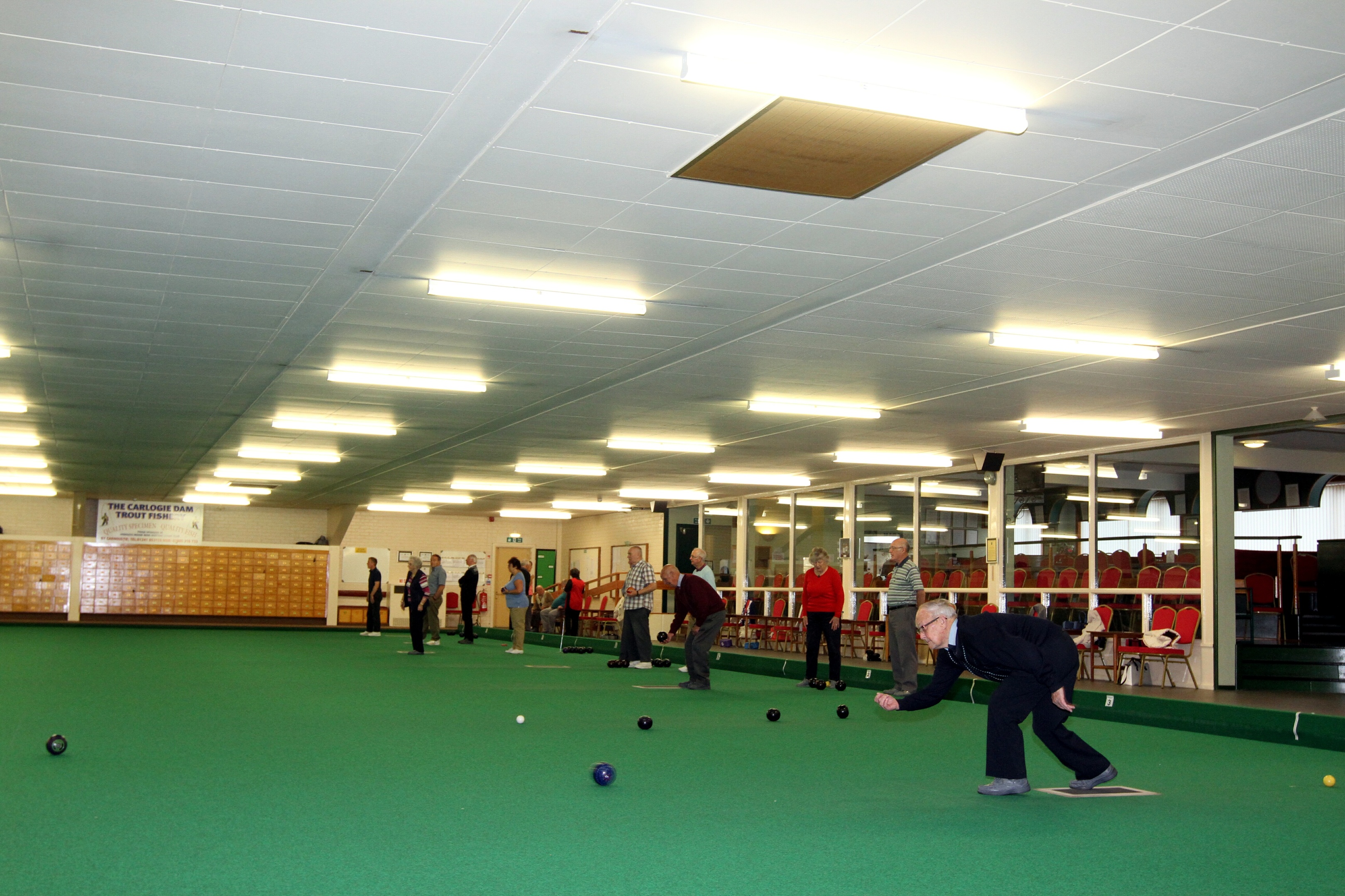 Bowlers in action at Arbroath & District Indoor Bowling Club.