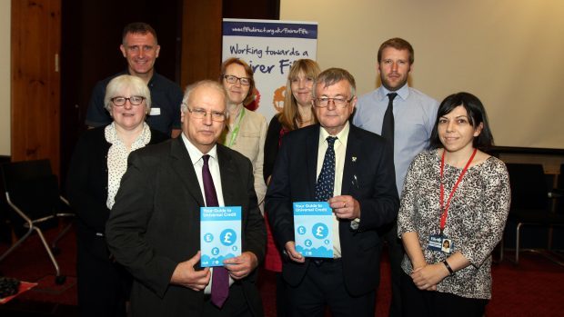 Councillor David Ross (front left) and Councillor David Alexander at the launch of Fife Council's advice leaflet into Universal Credit.