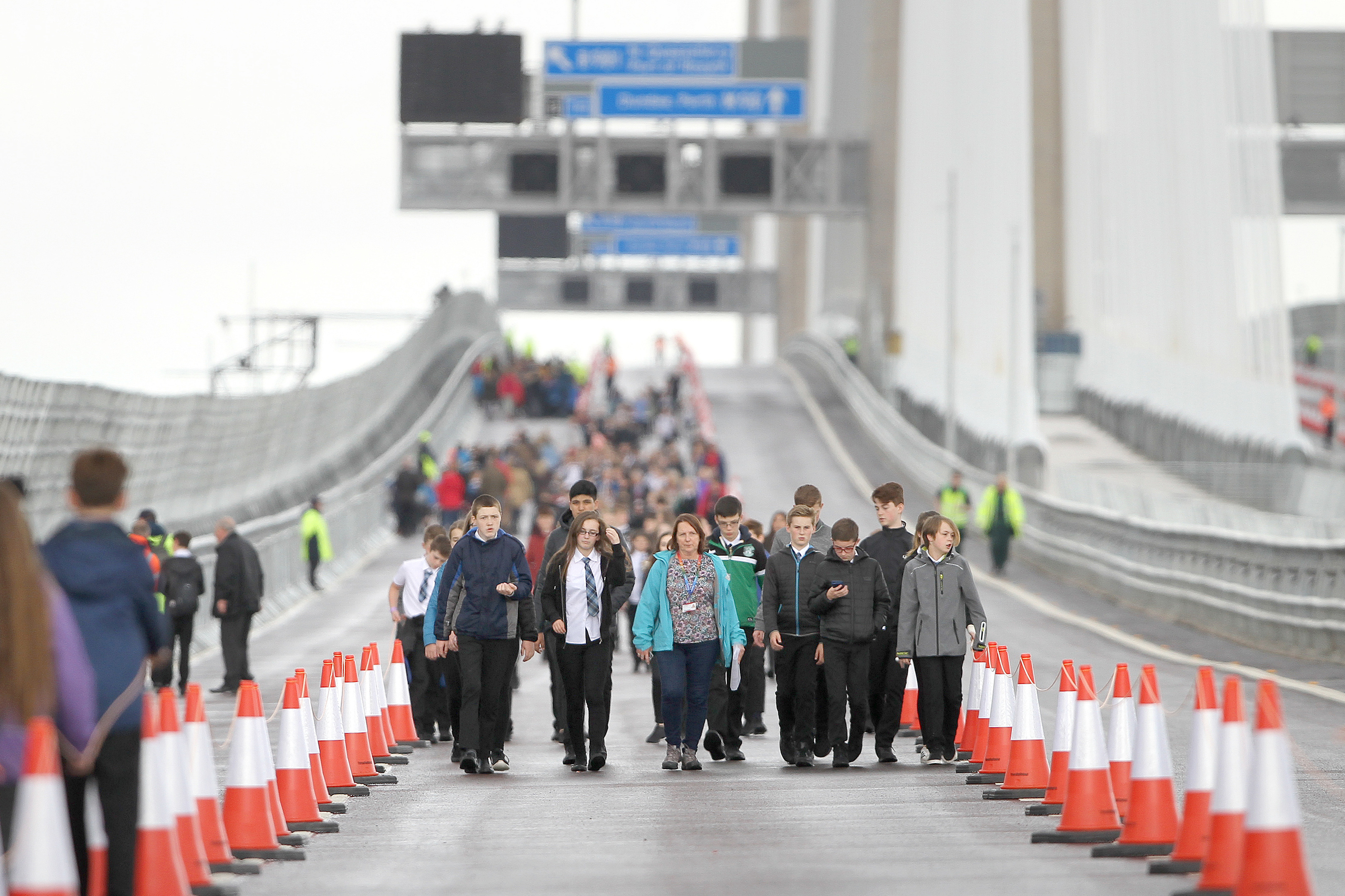 Pupils from Queensferry High crossing the bridge.