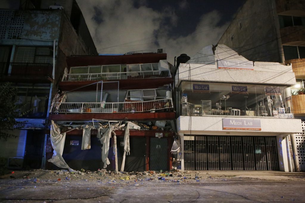 A collapsed building is seen an night in the Roma neighborhood of Mexico City