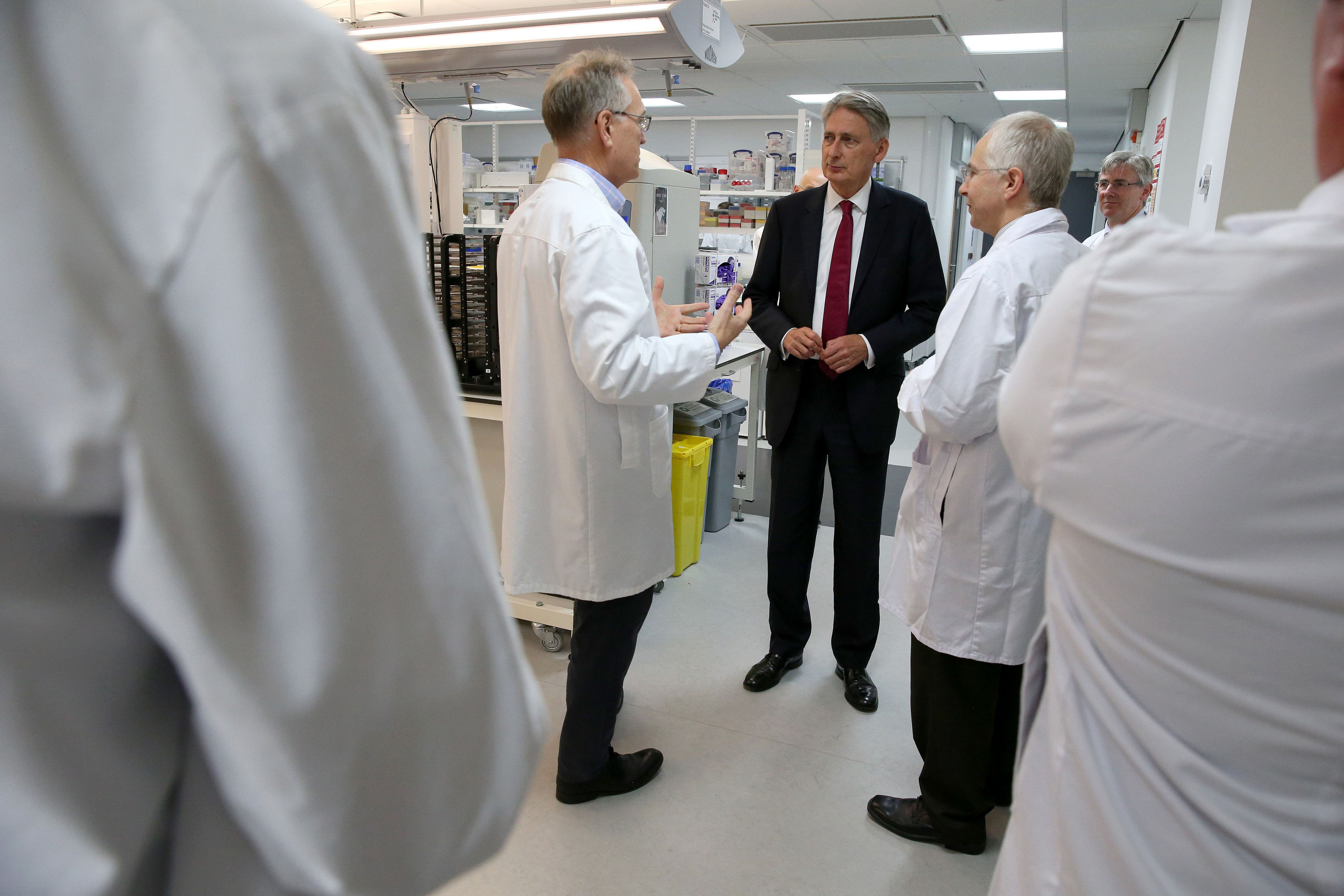 Chancellor Philip Hammond is shown around a lab by Professor Paul Wyatt (left) during a visit to Dundee University's School of Life Sciences.