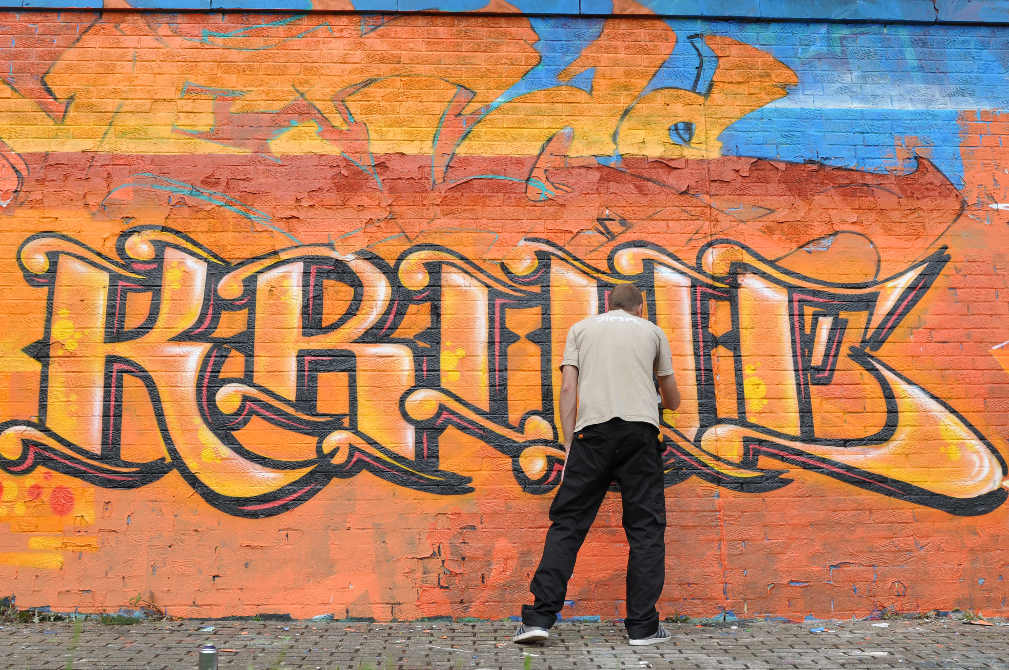 One of the graffiti artists at work