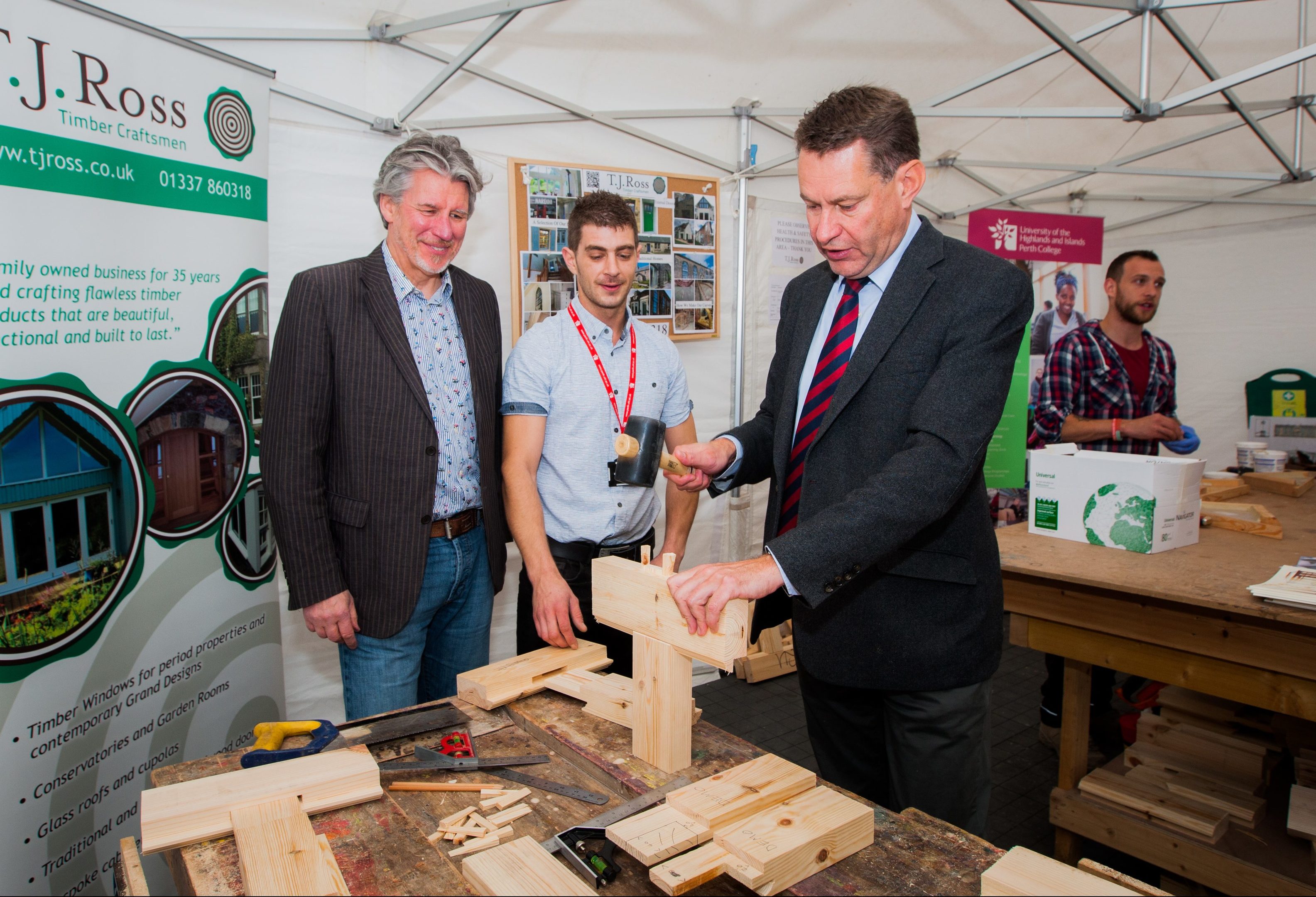 Picture shows left to right, Martin Richardson (owner of TJ Ross Joiners, John Daly (lecturer Perth College UHI (joinery) and Murdo Fraser MSP trying his hand at joinery.
