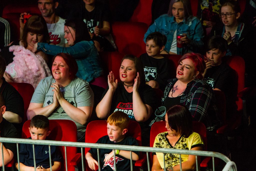 Fans at the wrestling event.