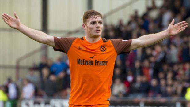 Fraser Fyvie celebrates after his superb strike made it 3-0.