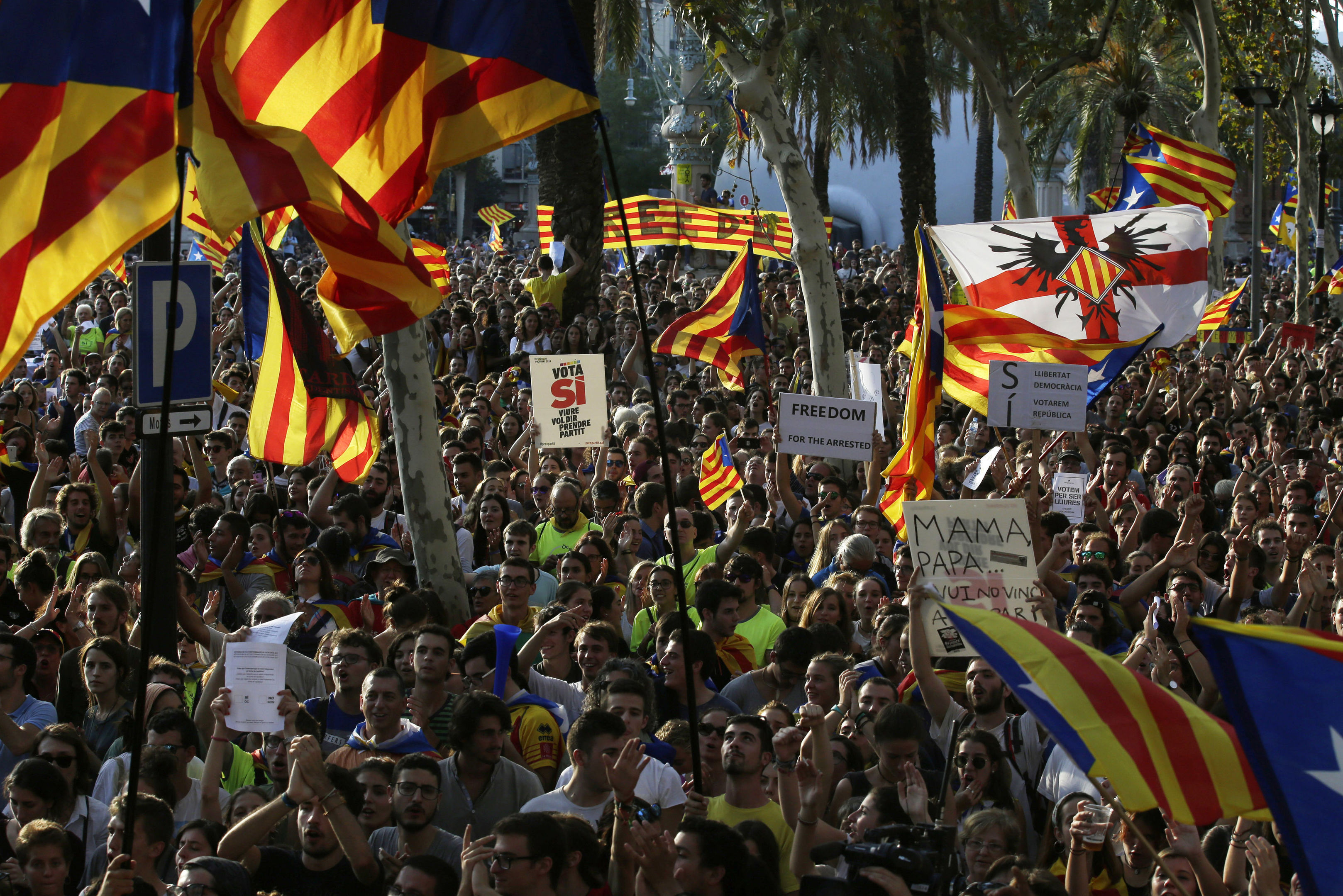 People shout slogans during a protest in Barcelona.