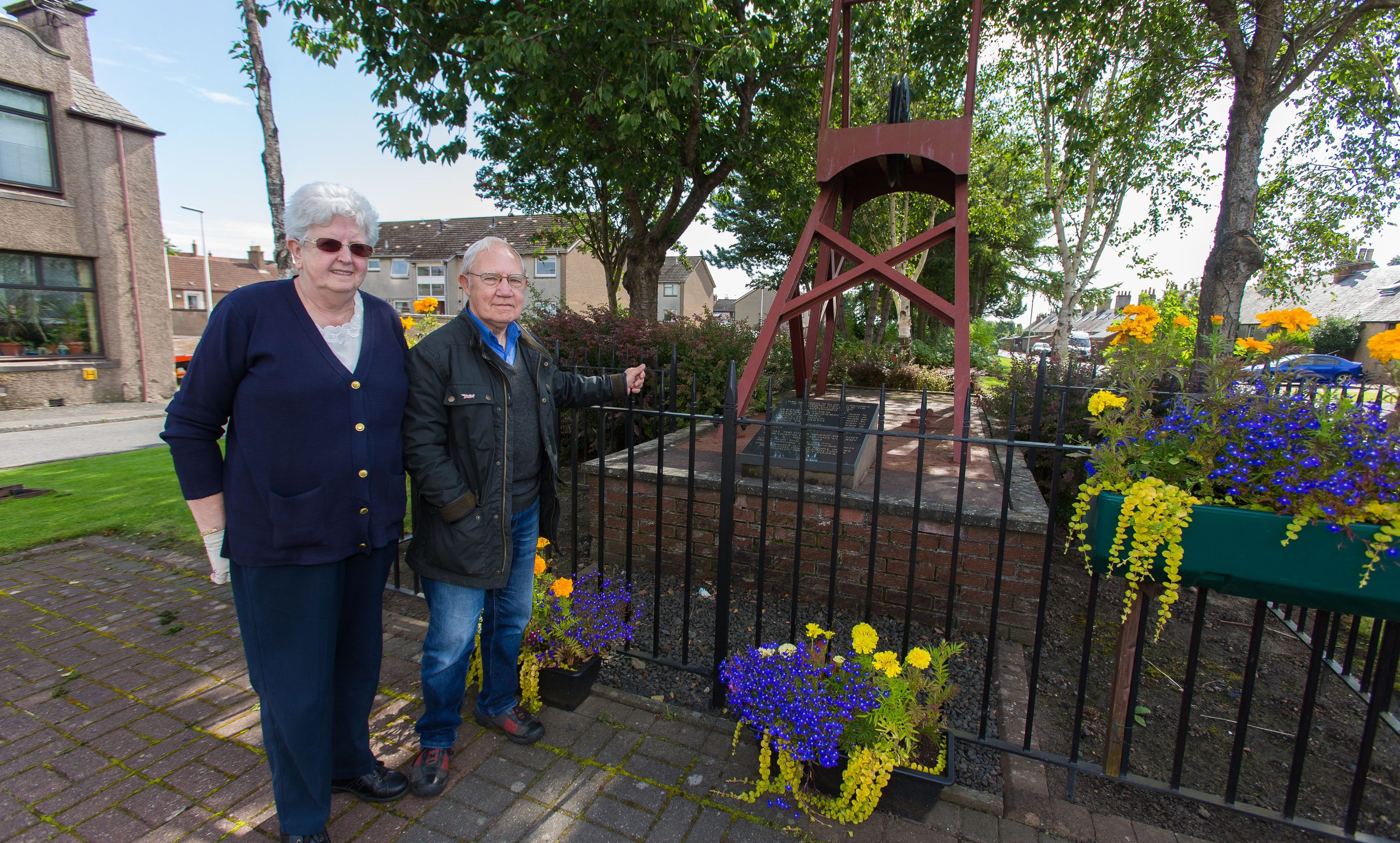 Elizabeth McGuire and Sandy Turner from Fife Mining Preservation Society at the Michael Colliery Memorial before the vandalism