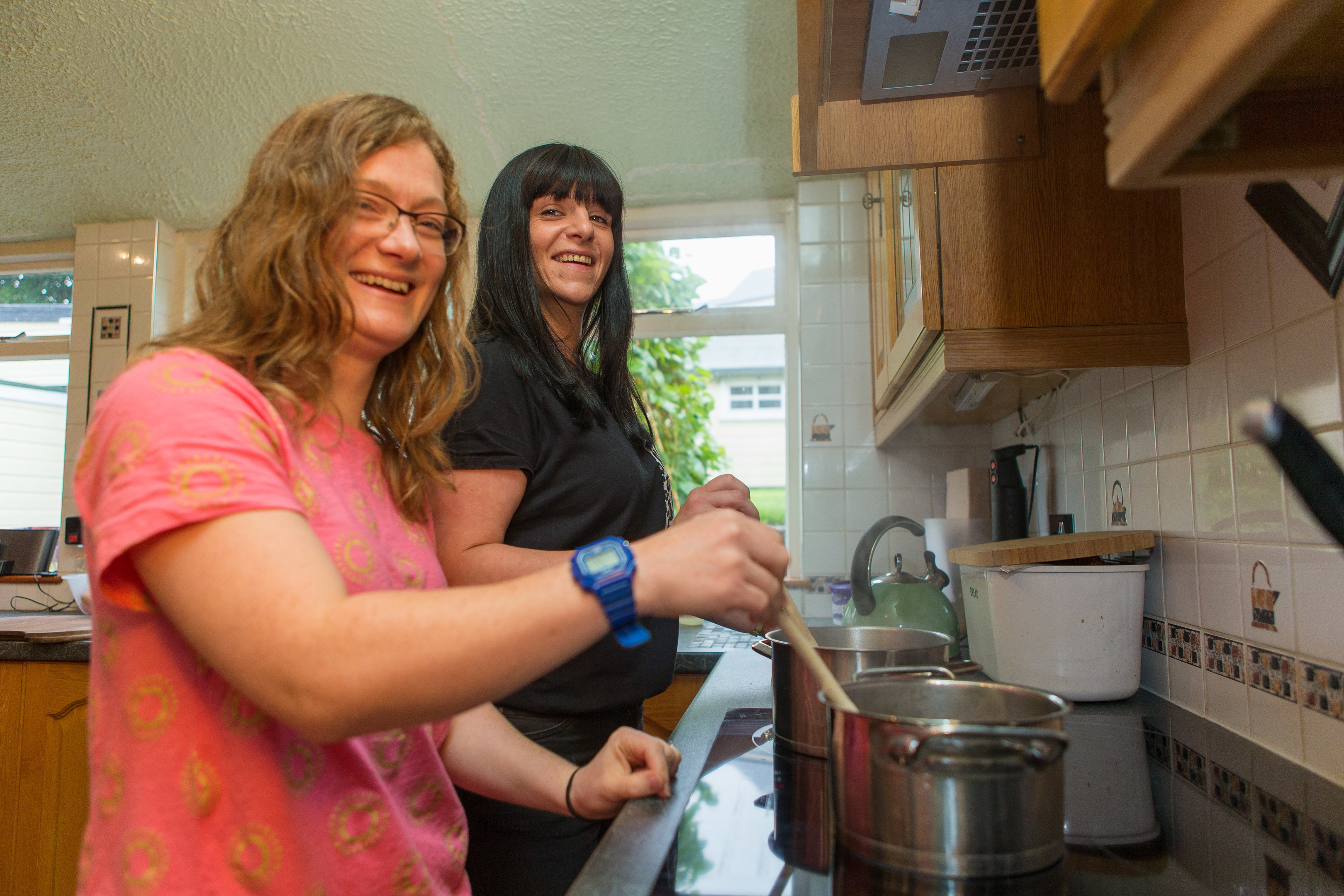 Jennifer Foster, 33,  is a Volunteer Cook with Rhea Long, 34, of The Food Train cooking in the kitchen.