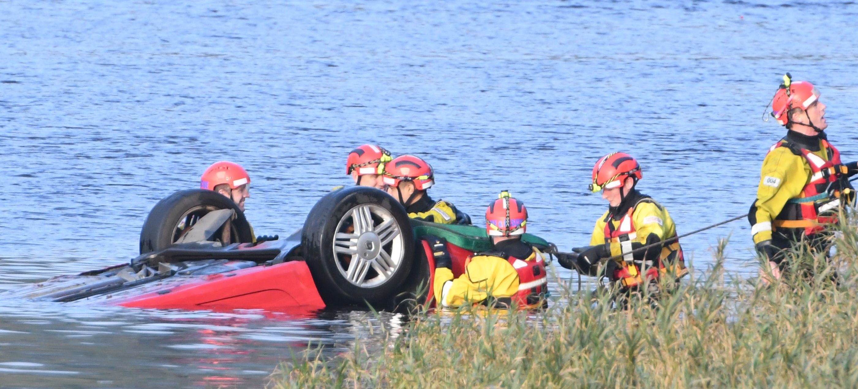 Emergency crews removing the car from the River Tay on Tuesday.