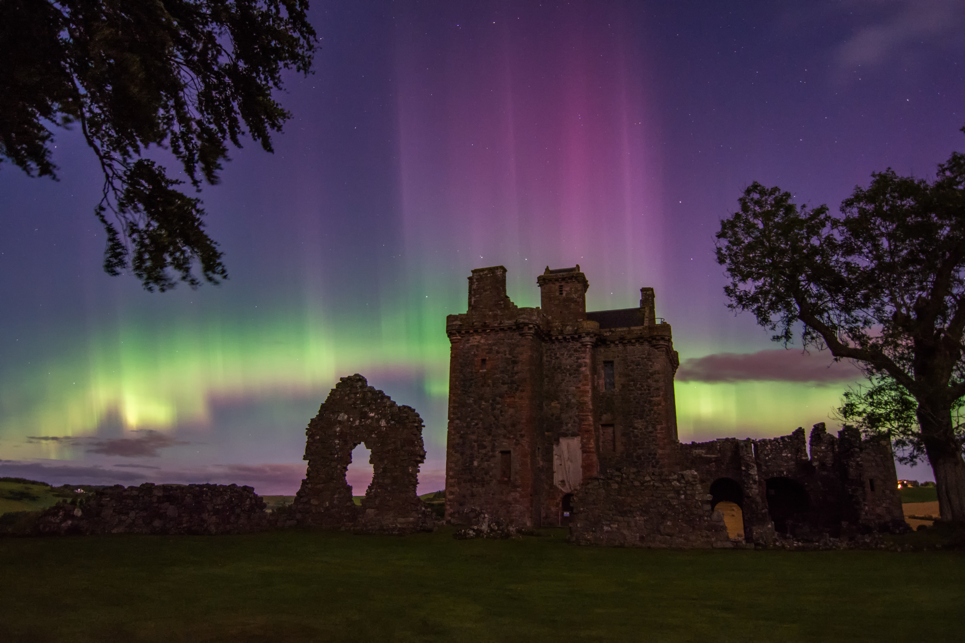 The aurora above Balvaird Castle. Photo: Katherine Fotheringham of Fox in the Snow Photography.