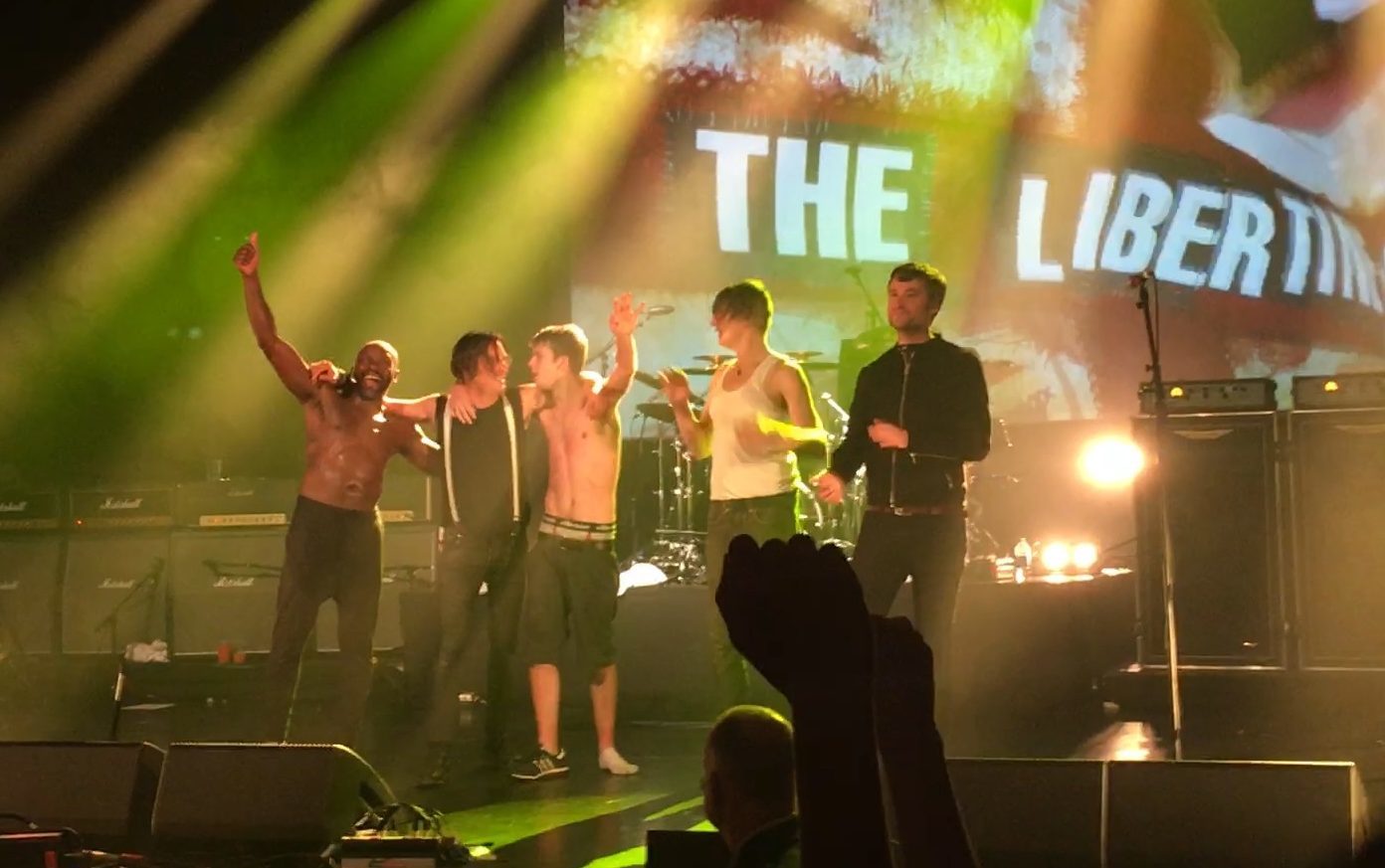 Libertines fan is welcomed on stage by the band in Dunfermline.