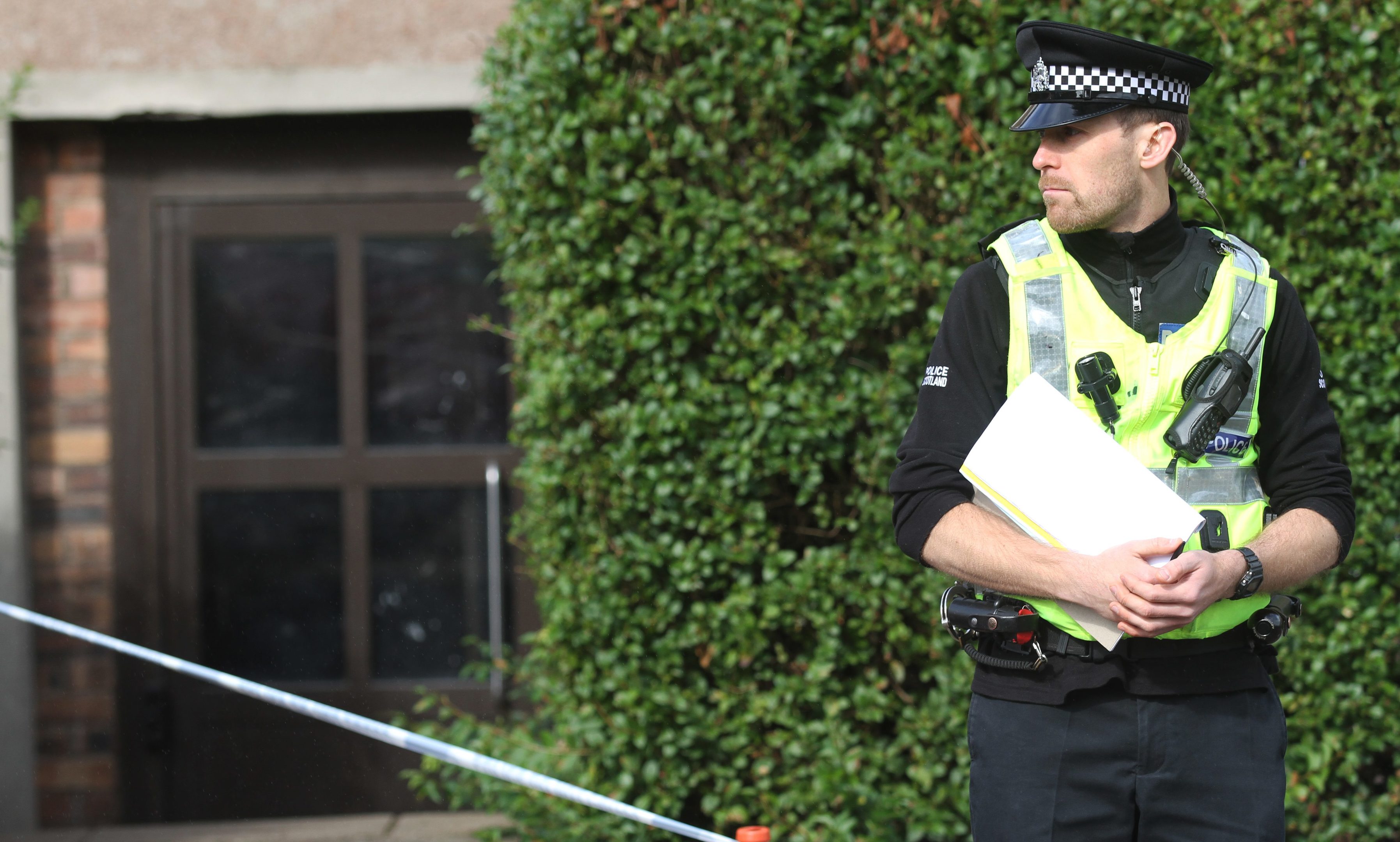 A policeman stands guard.