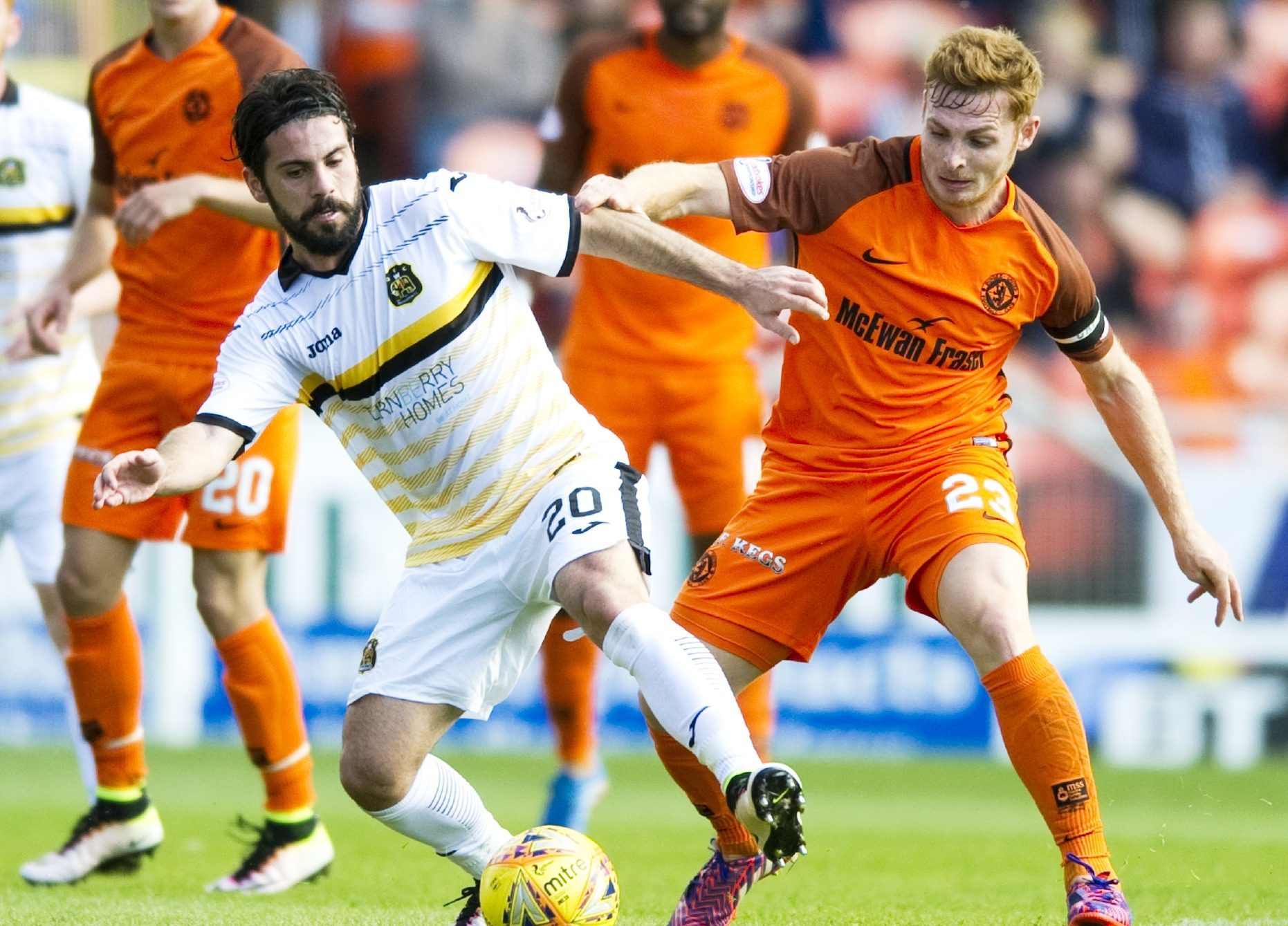Dimitris Froxylias and Fraser Fyvie battle for possession.