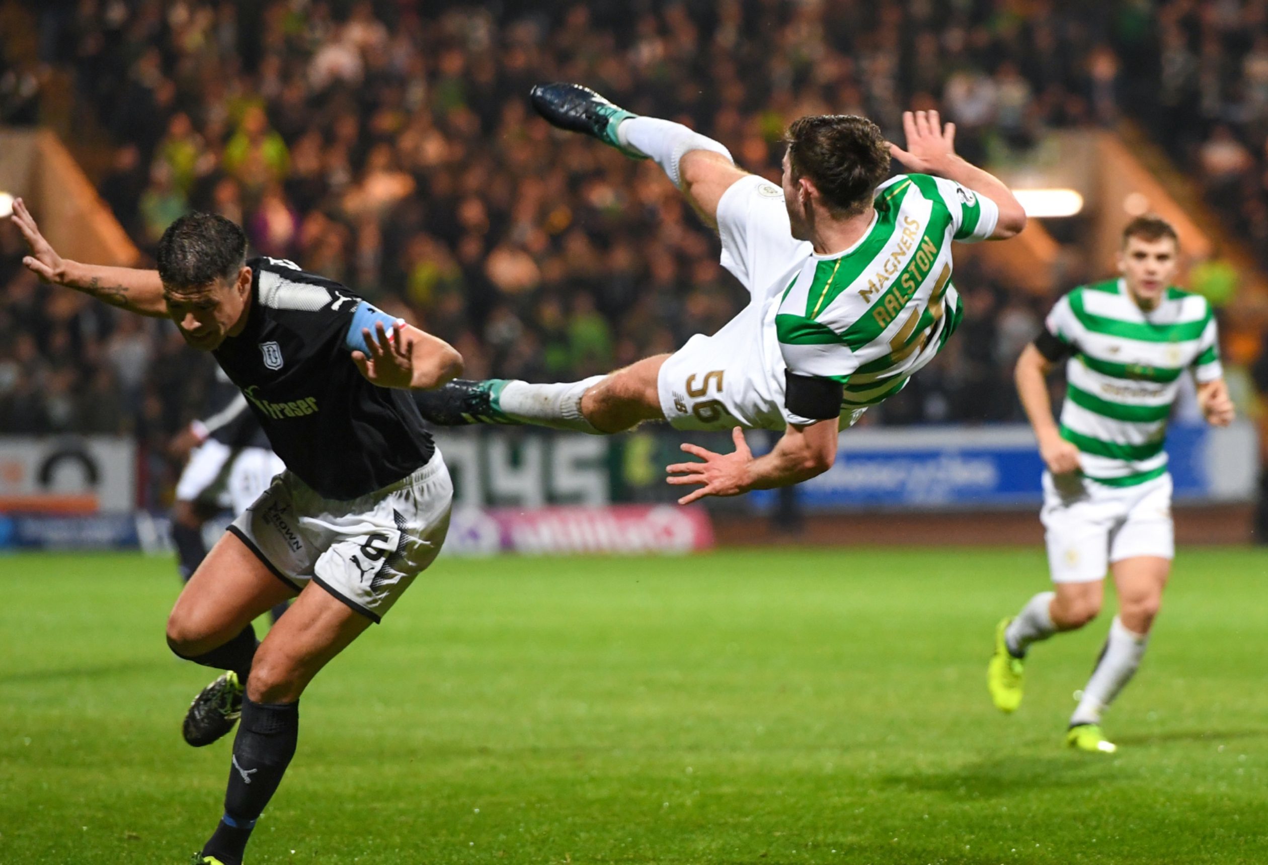 Darren O'Dea sends Anthony Ralston of Celtic flying.