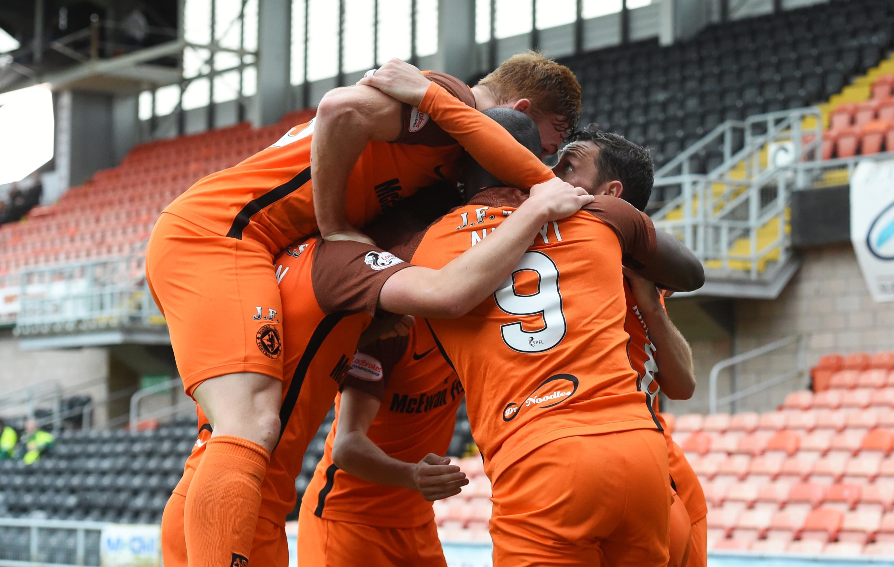 United players pile in to celebrate after Scott McDonald scores the winner against Morton.