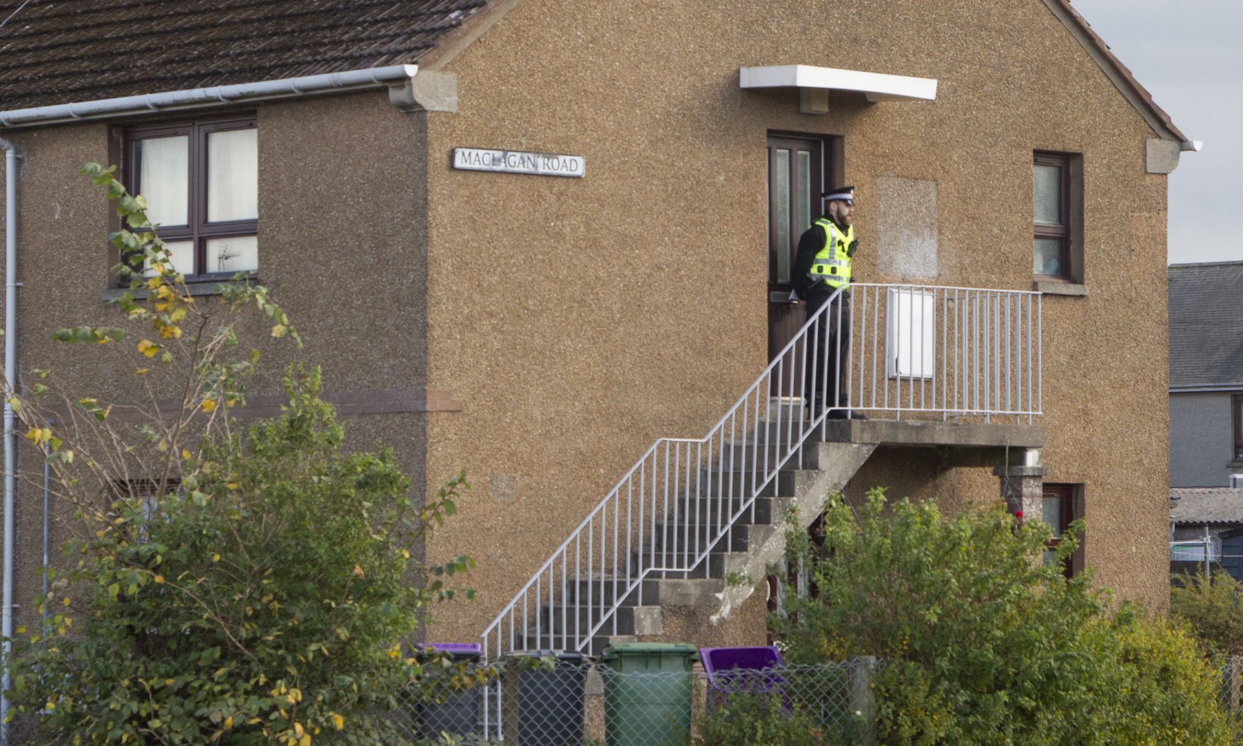 A police presence remained at a flat in Maclagan Road, Carnoustie.