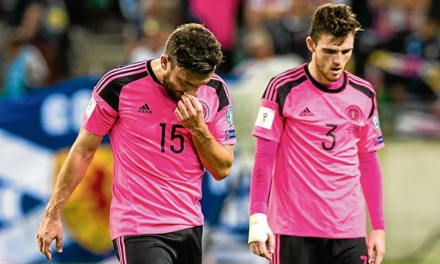 Dejection for Scotland's Robert Snodgrass and Andrew Robertson at full-time.
