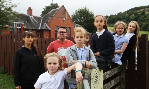 Treasurer and Chairman of the Parents Council Claudia Lacoux and Gerard McGoldrick with the entire school roll: front to back, Anna McGoldrick, 9, Maya King, 9, Lucy MacGregor, 8, Bea Meldrum, 9 and Elle Lacoux.