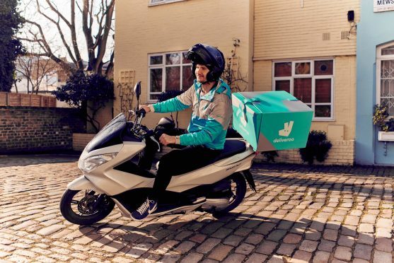 A Deliveroo rider.