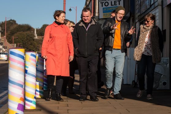 Artists show council employees their artistic bollards