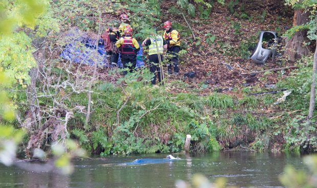 Emergency services at the River Tay after being alerted to a car in the water just west of Aberfeldy.