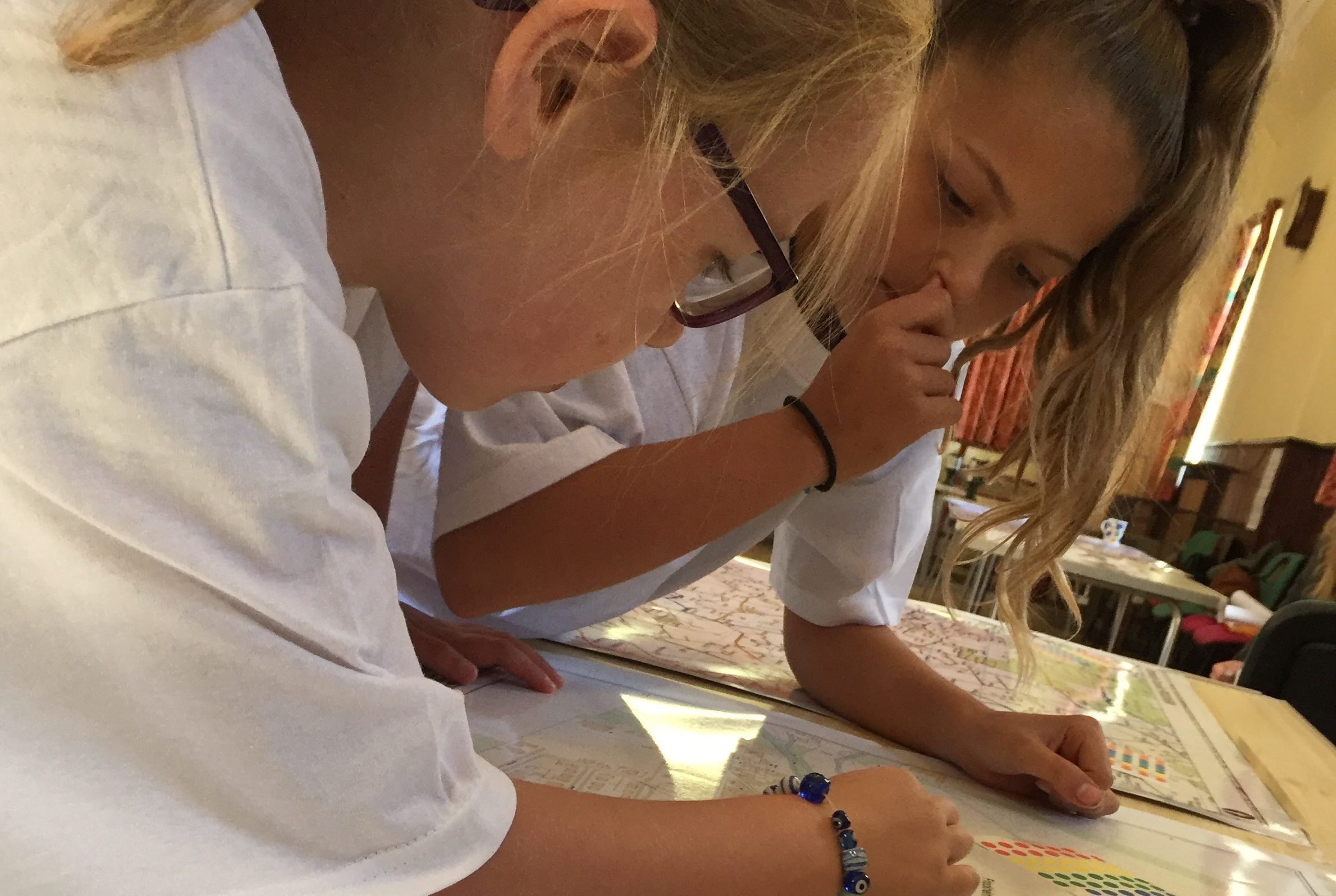 School children Kirstin Neate and Kristie Wilson pore over the plans at the event.