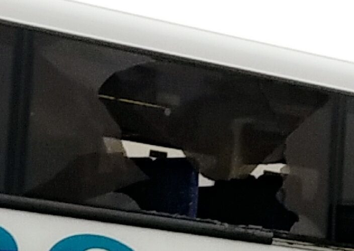 The side window of the bus was badly smashed.