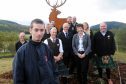 Aberfeldy youngster Bailey Pearce who works at The Workshop and helped design the piece with Highland Safaris staff, John Swinney MSP and the stag sculpture.