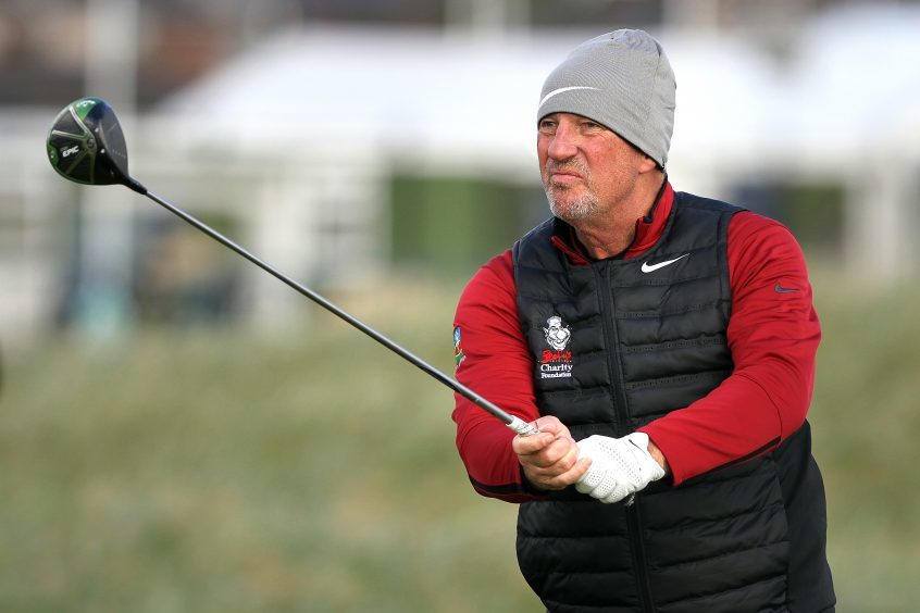 Sir Ian Botham on the course at Carnoustie.