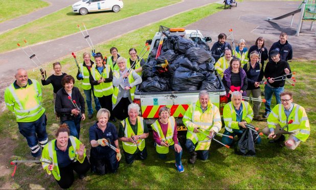 Perth and  Kinross Council, Community Greenspace and Beautiful Perth working together. Picture shows most of those that helped to clean up the Lade with the rubbish in black bags.