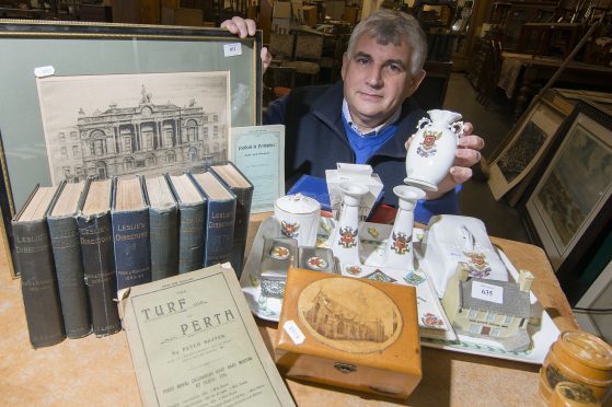Iain Smithwith some of the items collected by  former councillor & Perth historian , Stan Keay